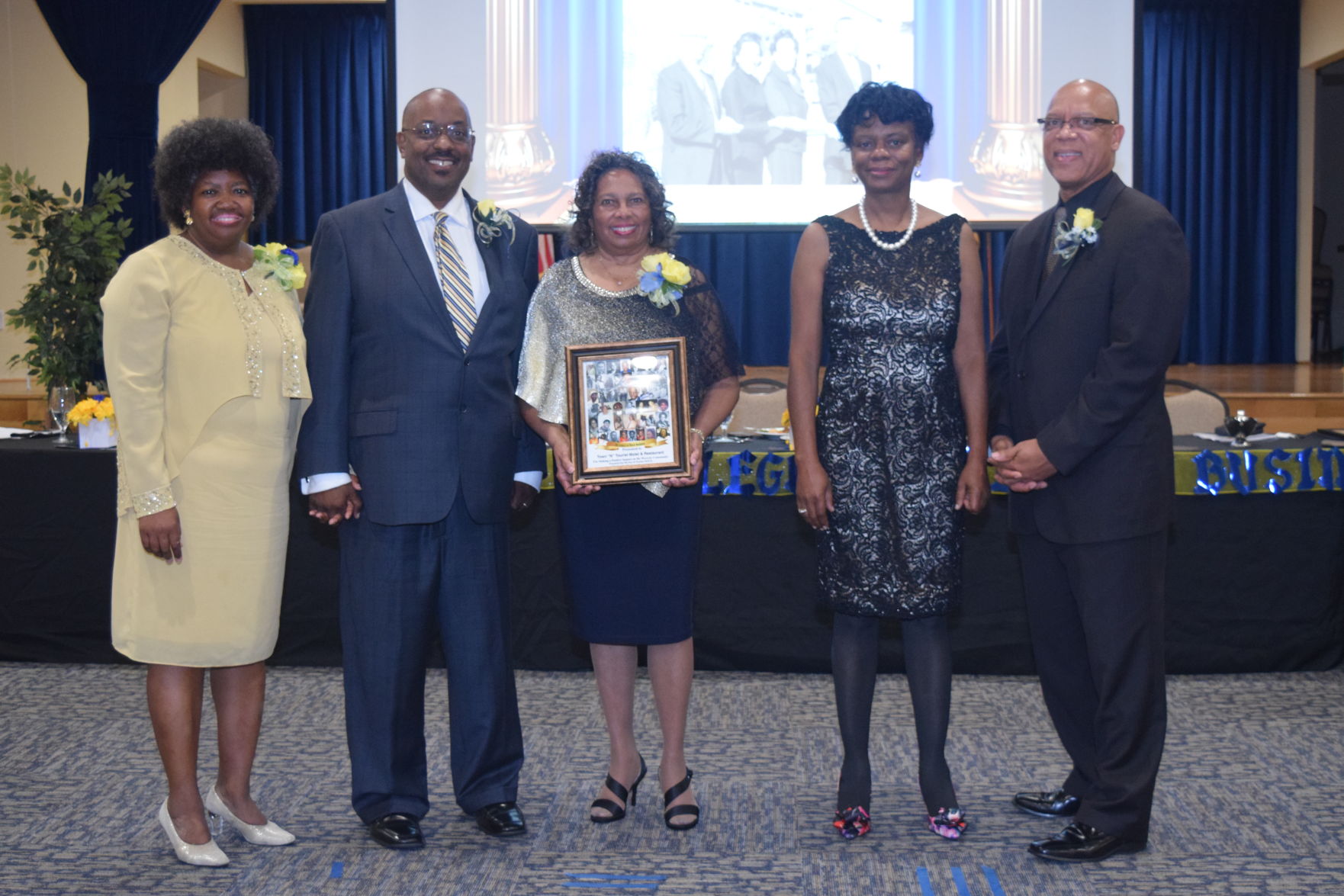 Cecily Johnson accepts Legacy Award for Town "N" Tourist Motel & Restaurant.